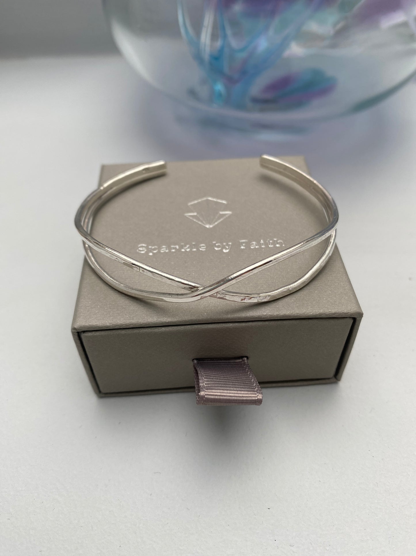 Sterling silver textured crossover bangle