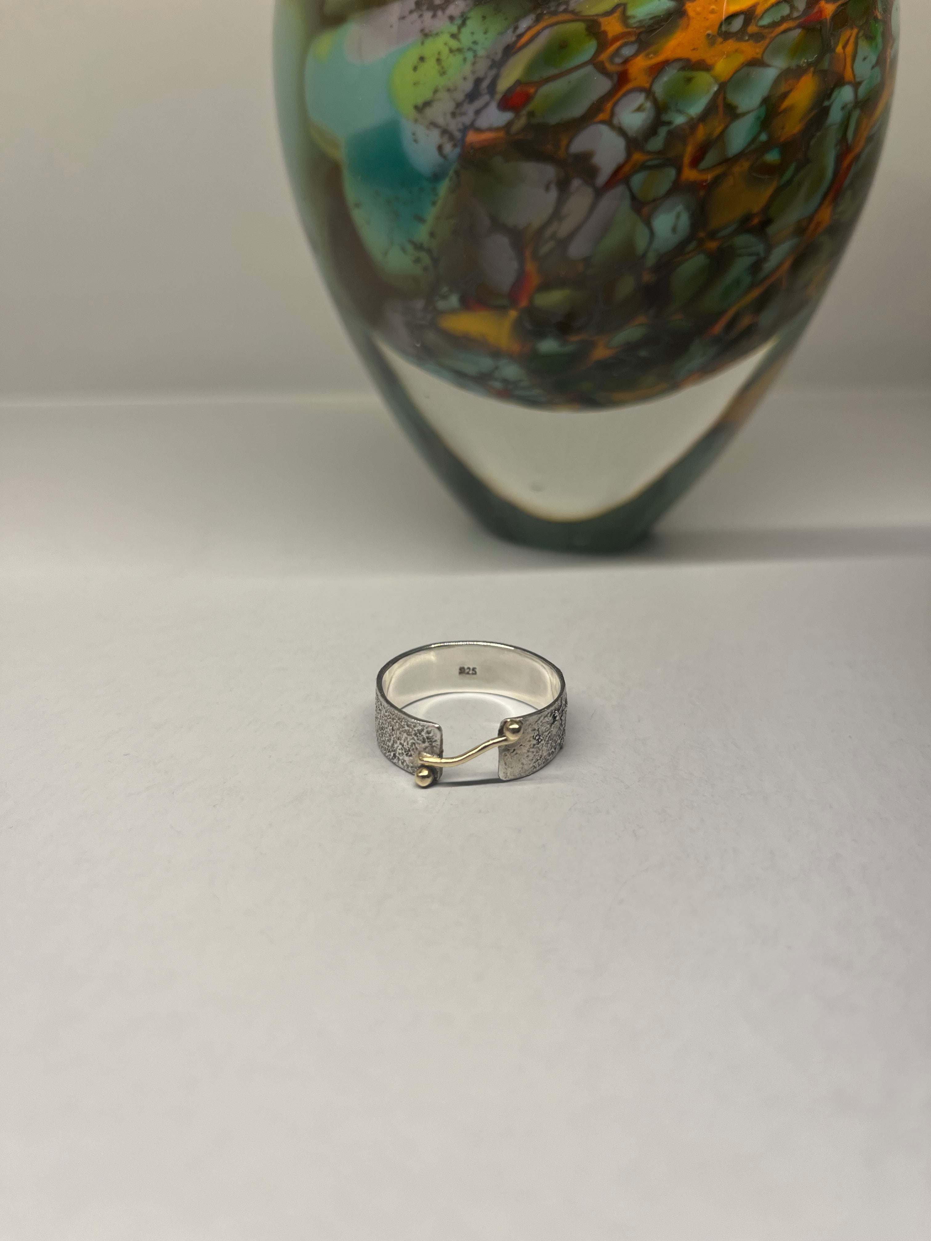 Sterling silver and 9ct gold molten ring