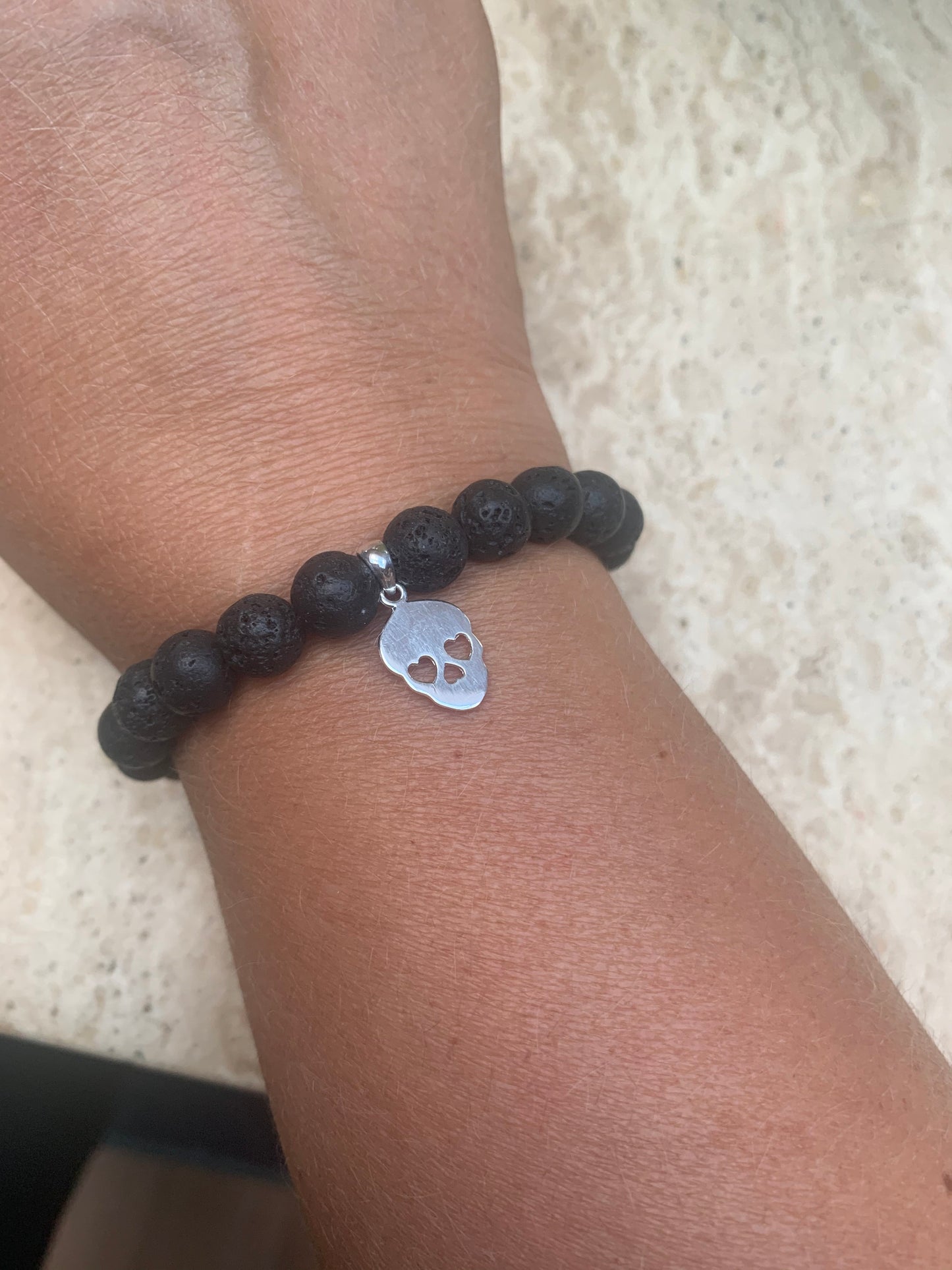 Lava bead and sterling silver skull bracelet