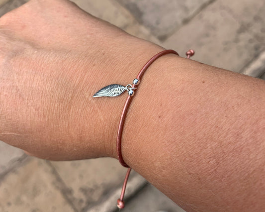 Peach leather with sterling silver charm bracelet