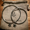 Sterling silver bangle with heart charm